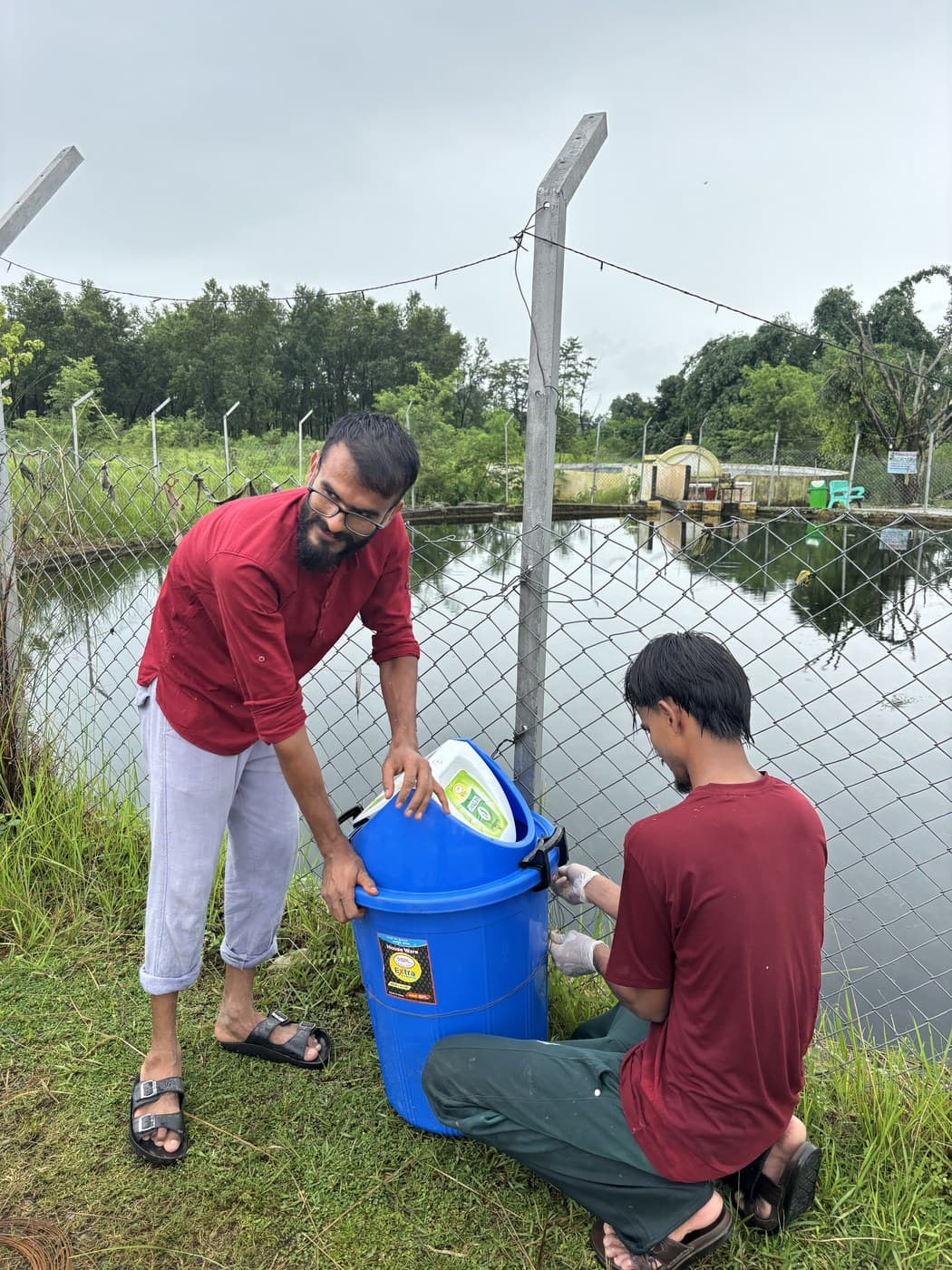 Fixing a bin in place beside the pond