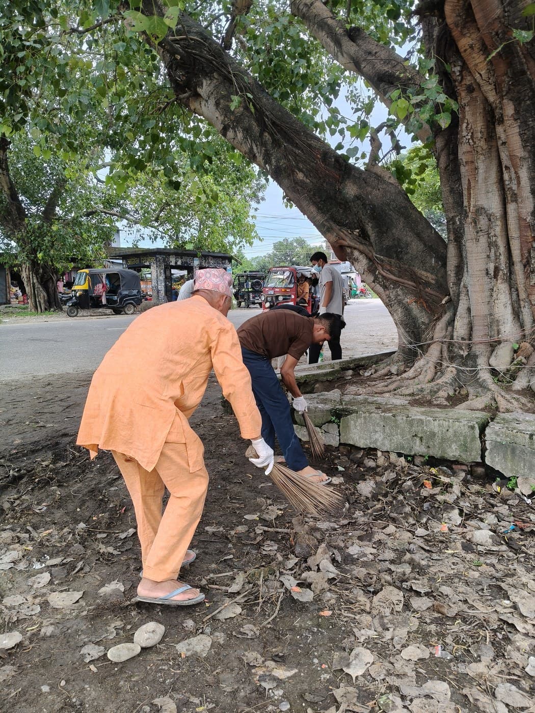 A neighbour picks up a broom and joins in