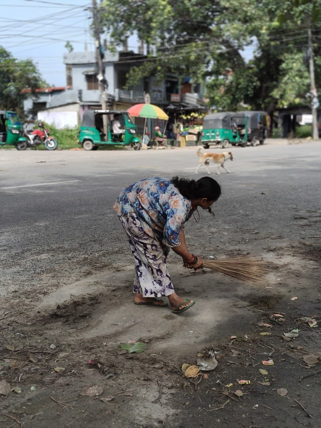 Sweeping the road through the chowk