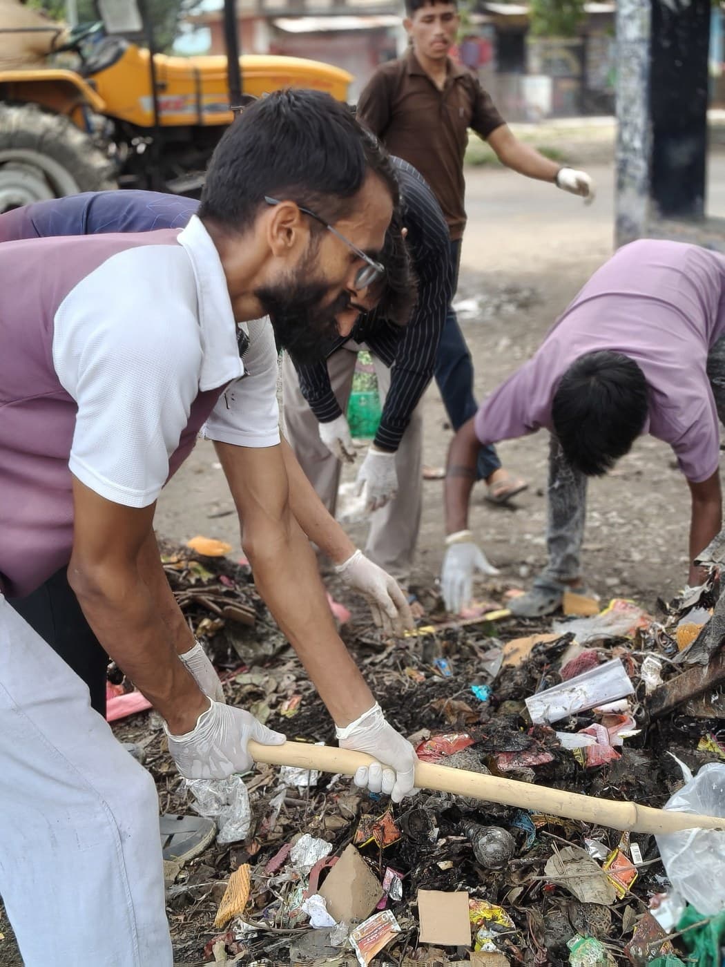 Raking out waste pressed into the ground
